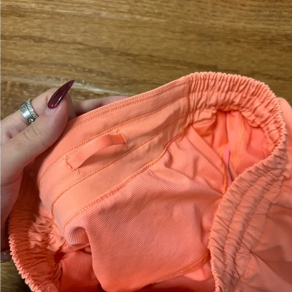 Lululemon hotty hot low rise HR coral pink orange shorts 4” lined