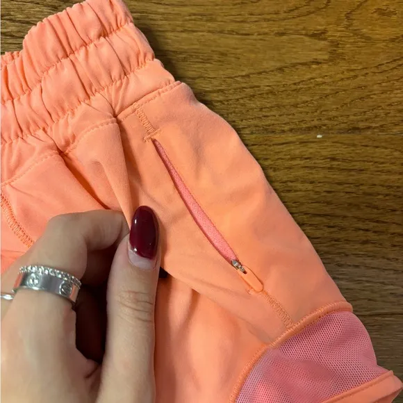 Lululemon hotty hot low rise HR coral pink orange shorts 4” lined