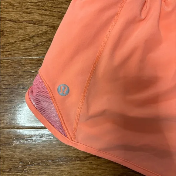 Lululemon hotty hot low rise HR coral pink orange shorts 4” lined