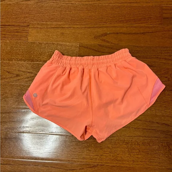 Lululemon hotty hot low rise HR coral pink orange shorts 4” lined
