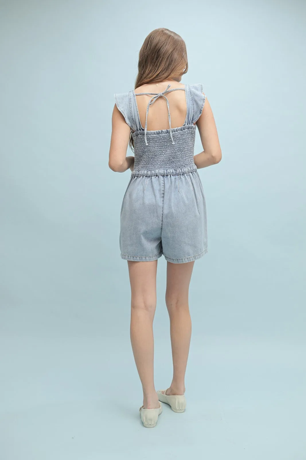 The Leila Ruffle Sleeve Denim Romper